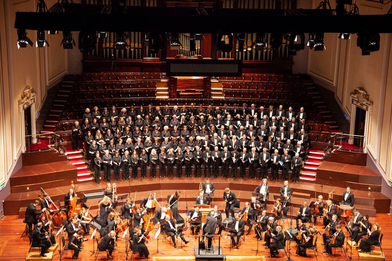 gallery-4 A majestic orchestra and choir performing at a historic venue in Edinburgh, Scotland.