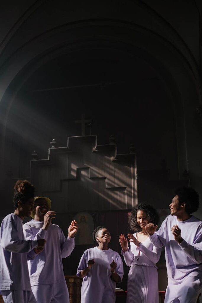 The Art of Drawing Readers In: Your attractive post title goes here Group of people singing and dancing in a sunlit church setting, expressing faith and joy.